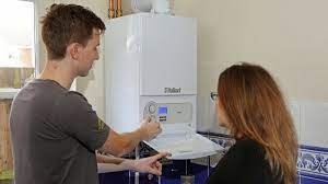 Engineer explaining a boiler system to a customer